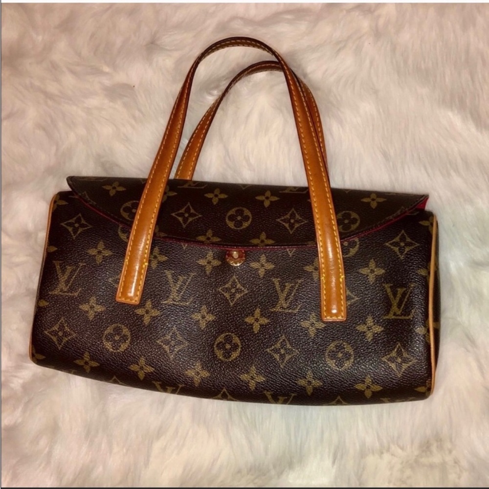 Louis Vuitton clutch purse.